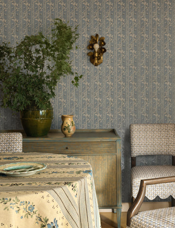 #color::aged-brass | Garda ornate floral metalwork wall sconce by Heidi Caillier hung on a wall over a sideboard cabinet