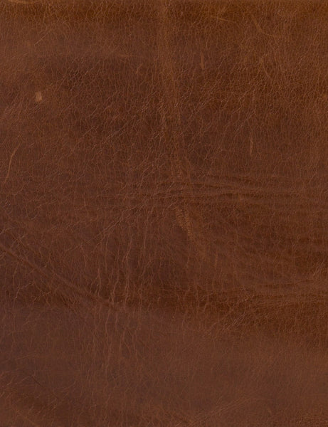| Close-up of the brown leather for the Marlyne accent chair