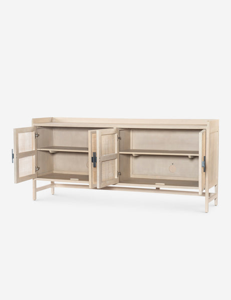 #color::natural | Angled view of the Philene natural mango wood sideboard with cane doors with all four doors open, revealing the inner shelving