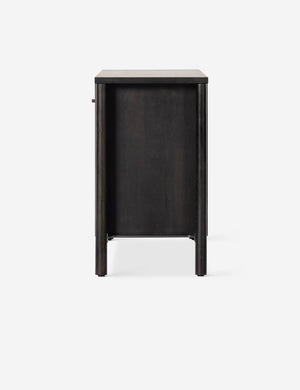 Side view of the Isaura black cane-paneled sideboard cabinet.