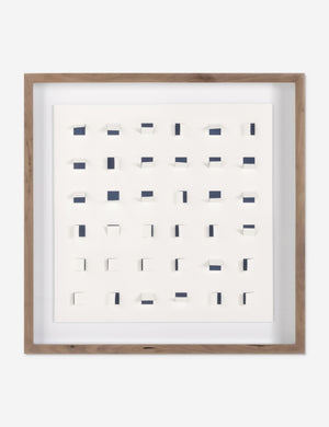 See Through small navy and white wall art featuring square paper cutouts with flaps on a linen backdrop