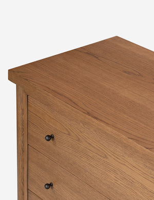 Close up view of the Kisner natural grain oak dresser.