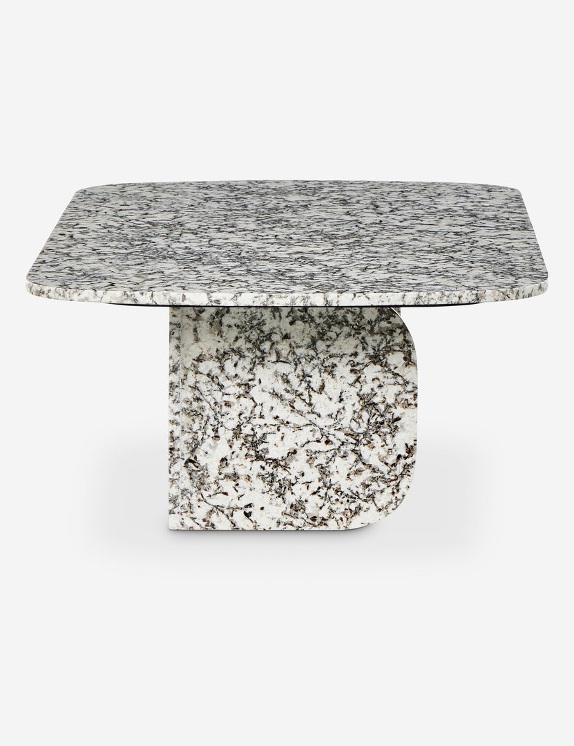 #color::speckled-black-marble | Side profile of the Sumalee sculptural solid marble coffee table.