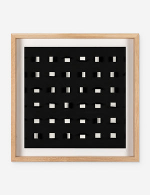 See Through small black and white wall art featuring square paper cutouts with flaps on a linen backdrop