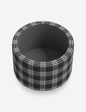 The storage space inside the Kamila Prep School Plaid 24-inch ottoman