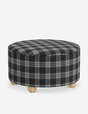 The storage space inside the Kamila Prep School Plaid 34-inch ottoman