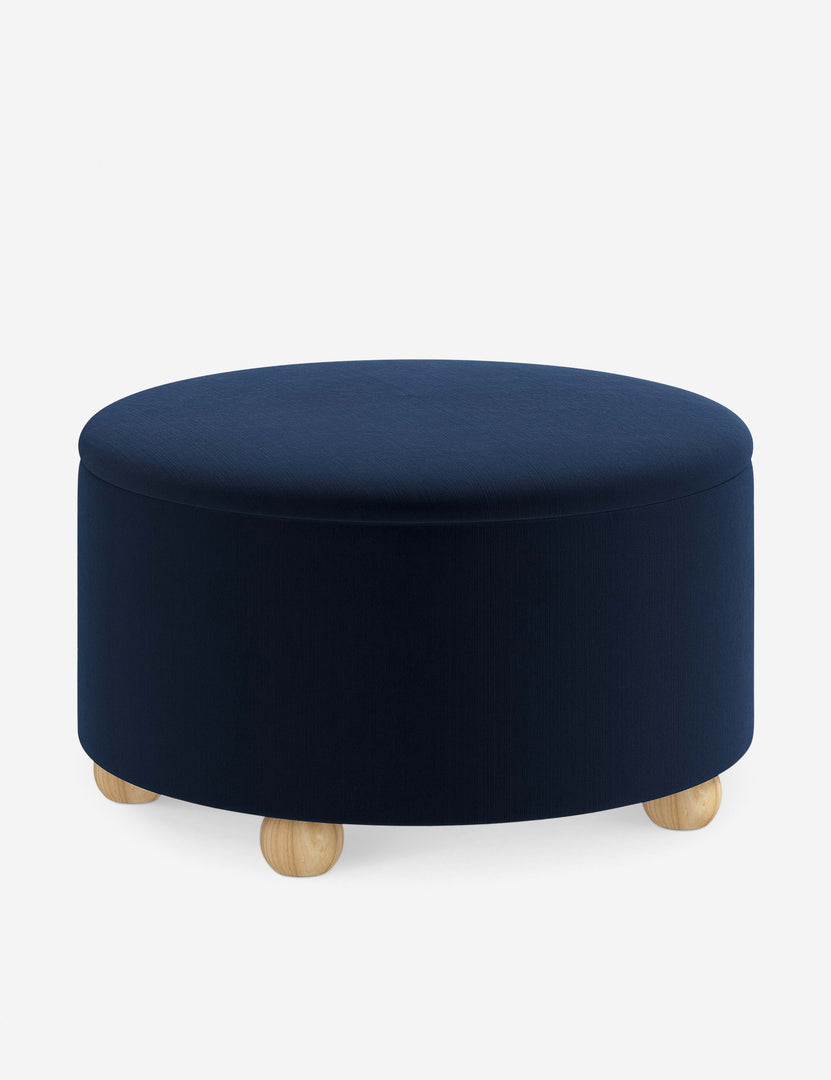 #color::navy-velvet #size::34-Dia | Angled view of the Kamila Navy Velvet 34-inch ottoman