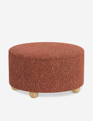 The storage space inside the Kamila Brick Boucle 34-inch ottoman