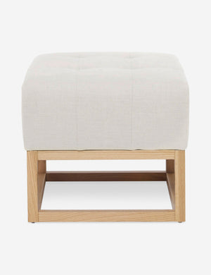 Oyster White Linen Grasmere Ottoman with an upholstered cushion and airy wooden frame by Ginny Macdonald
