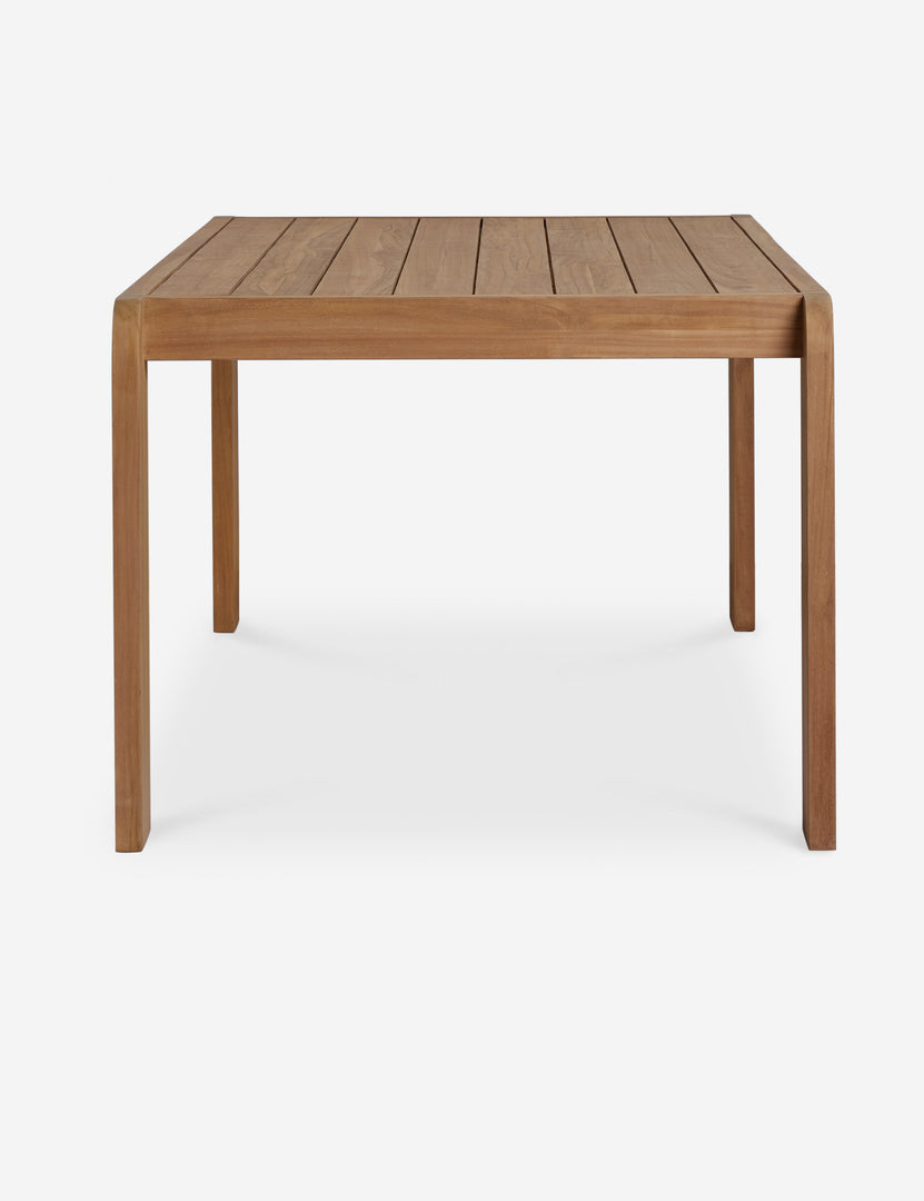 #color::natural-teak | Side view of the Abbot solid teak rectangular outdoor dining table by Sarah Sherman Samuel.
