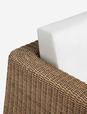 Close up of the arm of the Aisha wide arm modern wicker outdoor sofa.