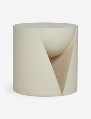 Angled view of the Amaya round sculptural cement side table.