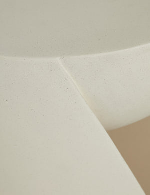 Close up of the Amaya round sculptural cement side table.