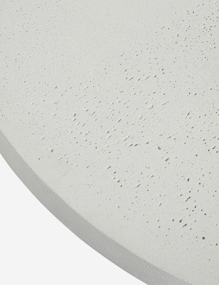 #color::textured-white | Close up of the top of the Avila modern round pedestal dining table.
