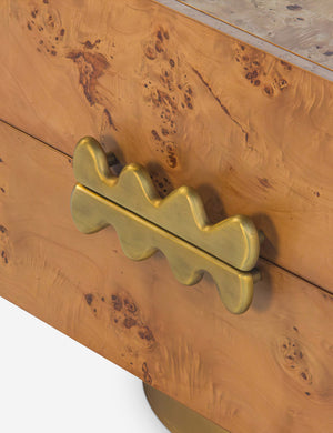 Close up of the brass drawer pulls of the Bertone burl wood 2-drawer nightstand