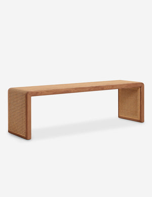 Angled view of the Canistel woven cane waterfall bench by Carly Cushnie.