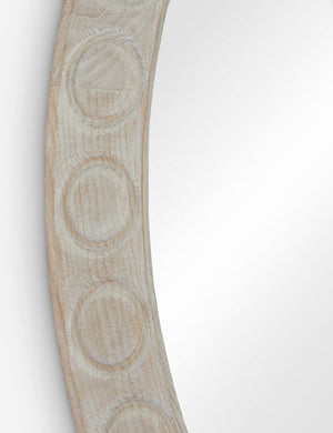 Close up of the Correa round distressed wood frame wall mirror.