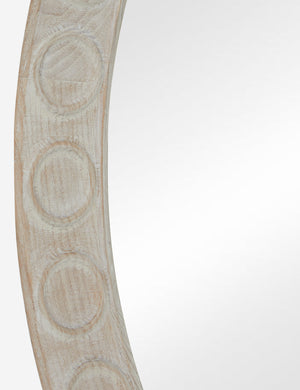 Close up of the Correa round distressed wood frame wall mirror.
