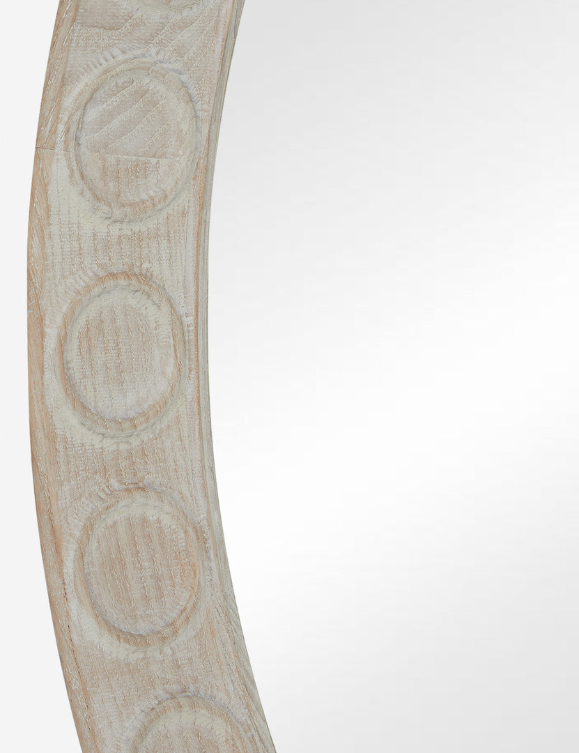 #color::natural | Close up of the Correa round distressed wood frame wall mirror.