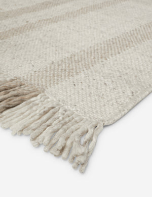 Close up of the fringe on the Croze handwoven striped fringed outdoor rug.