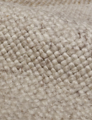 Close up of the Croze handwoven striped fringed outdoor rug.