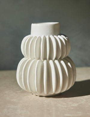 Delilah white ceramic vase featuring two rows of half-moon discs fanned around a tapered body