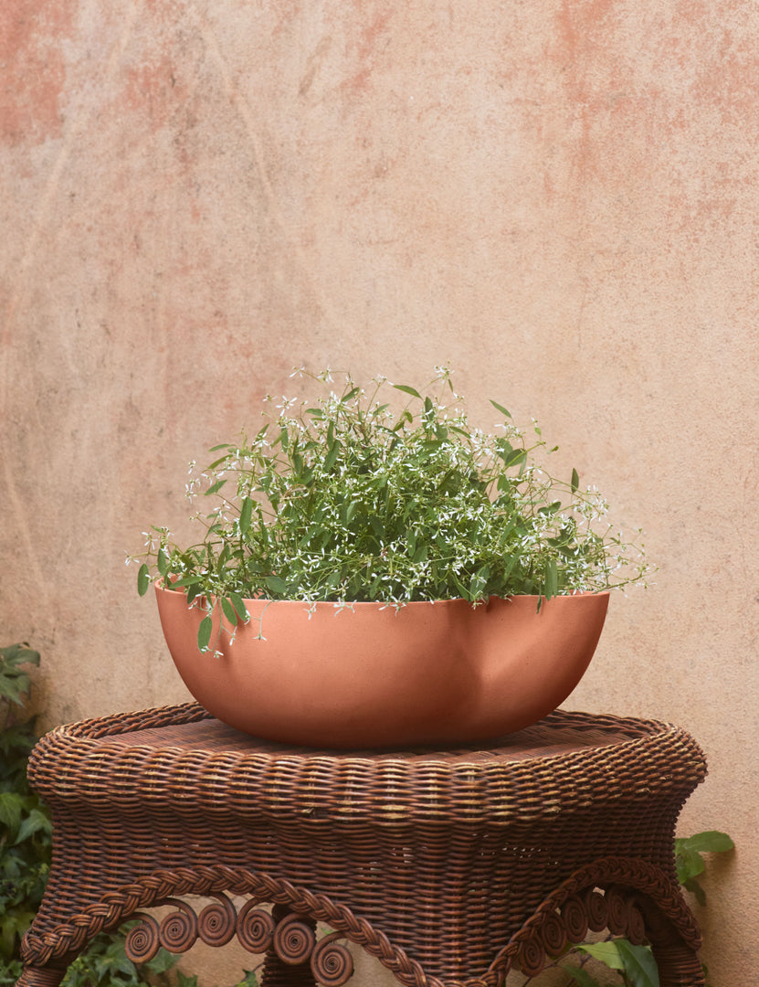 #color::sienna #style::large | Dempsy low sculptural large planter by Sarah Sherman Samuel in Sienna filled with flowers.