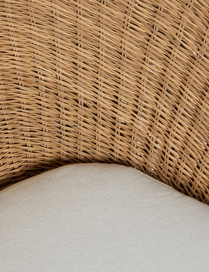 Close up of the Ferran sculptural wicker outdoor accent chair.