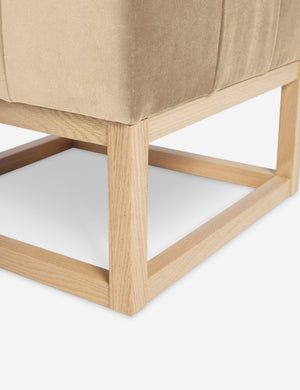 Close up of the airy wooden frame on the bottom of the Grasmere Brie Velvet Ottoman