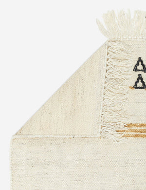 The corner of the Iconic Stripe Rug folded over