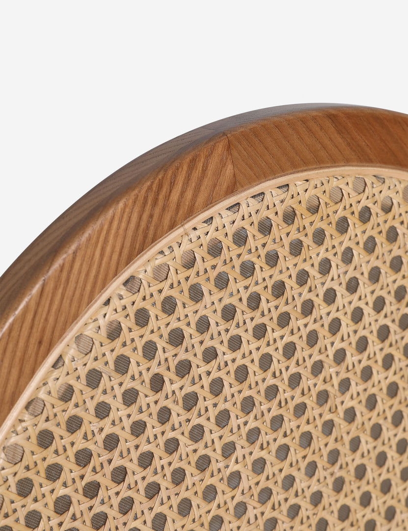 #color::light-espresso | Close up of the Kapok woven cane sculptural dining chair by Carly Cushnie.
