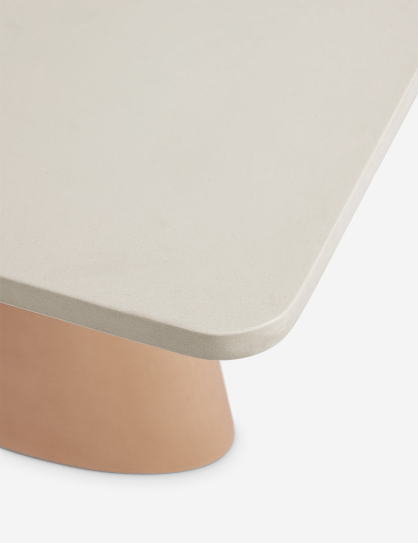 #color::ivory-and-terracotta | Corner of the Keating sculptural two-toned outdoor dining table.