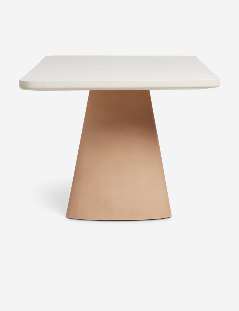 #color::ivory-and-terracotta | Side profile of the Keating sculptural two-toned outdoor dining table.