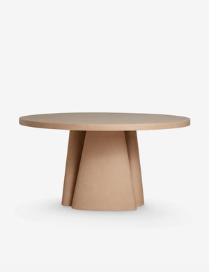 Side profile of the Keating sculptural round fiberstone outdoor dining table.