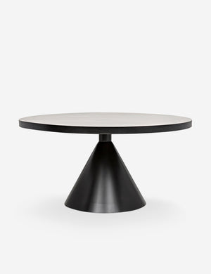 Kimani round black dining table with a dark metal finish and cone-shaped pedestal
