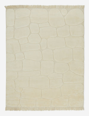 Kivi raised cobblestone pattern fringe wool area rug