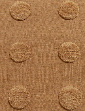 Close up of the Kohta high-low pile dot design wool area rug in camel