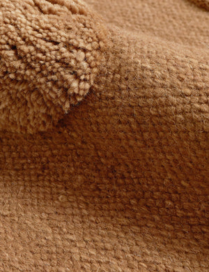 Close up of the Kohta high-low pile dot design wool area rug in camel