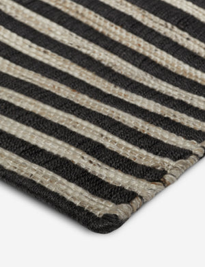 Corner of the Lavinia handwoven high contrast outdoor rug.