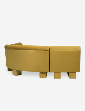 Rear view of the side of the Lena left-facing yellow velvet sectional sofa with upholstered beam legs.