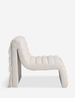 Side profile of the Leon textural boucle channel tufted armless accent chair by Carly Cushnie.