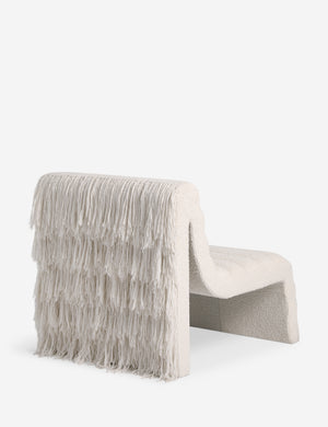 Angled back view of the Leon textural boucle channel tufted armless accent chair by Carly Cushnie.