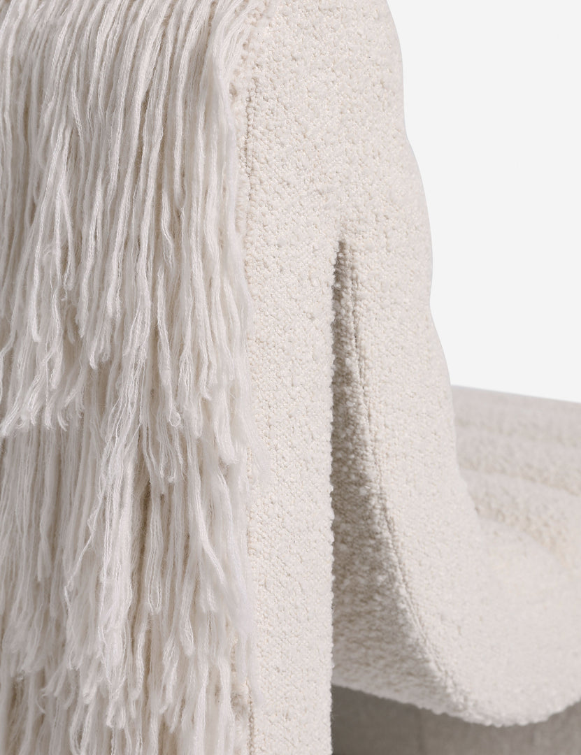 #color::ivory-boucle | Close up of the Leon textural boucle channel tufted armless accent chair by Carly Cushnie.