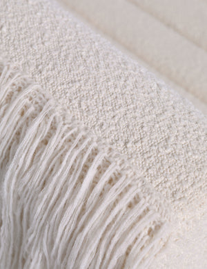 Close up of the Leon textural boucle channel tufted armless accent chair by Carly Cushnie.