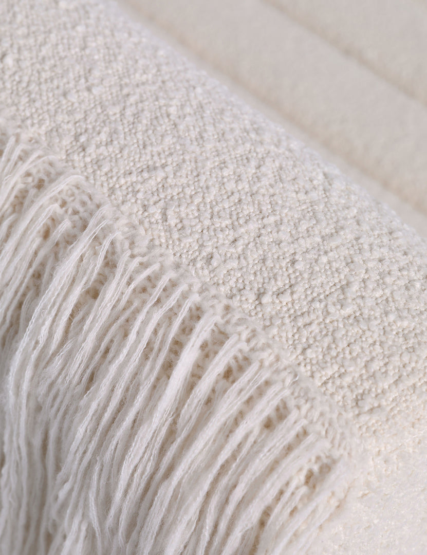 #color::ivory-boucle | Close up of the Leon textural boucle channel tufted armless accent chair by Carly Cushnie.
