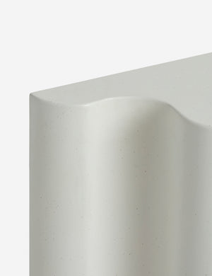 Close up view of the Lune half-moon, scalloped concrete console table