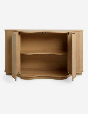 Cora half-moon, wavy light-wood sideboard with doors open