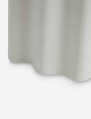 Close up of the Lune half-moon, scalloped concrete side table