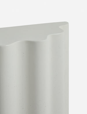 Close up of the Lune half-moon, scalloped concrete side table