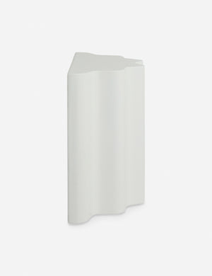 Side view of the Lune half-moon, scalloped concrete side table